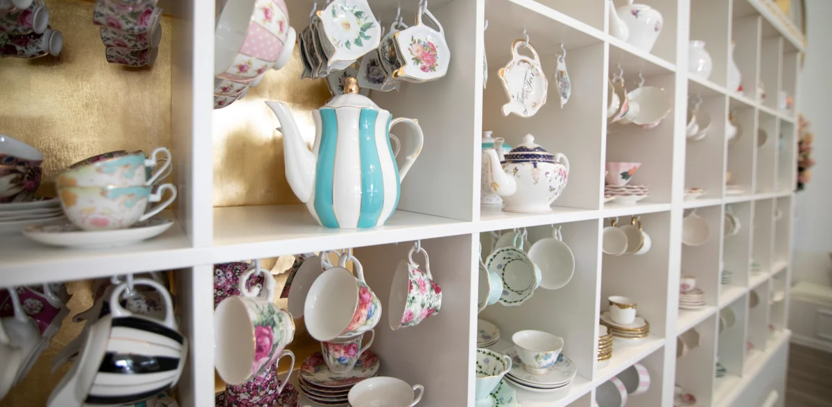 Colorful teapots on shelves
